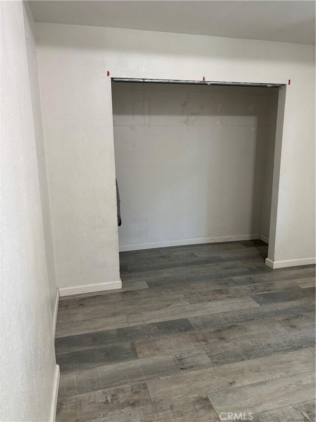 spare room featuring dark hardwood / wood-style flooring