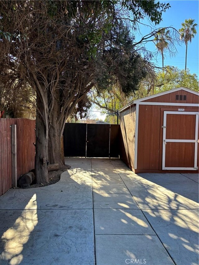 exterior space with a storage shed