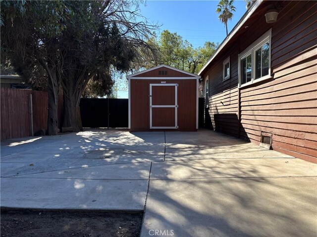 view of patio with a storage shed