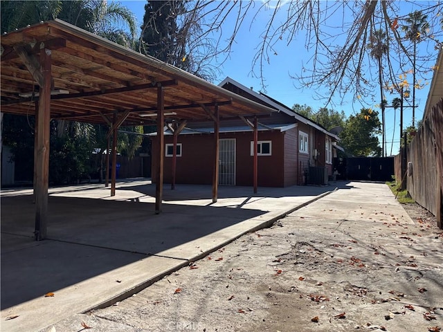 view of parking / parking lot with a carport