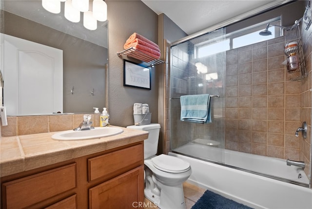 full bathroom with toilet, combined bath / shower with glass door, vanity, and tile patterned floors