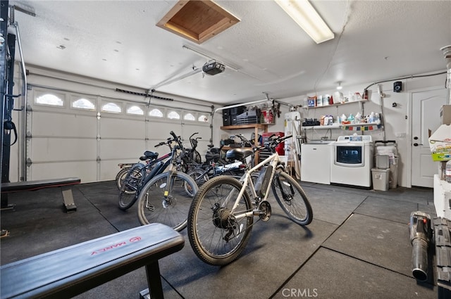 garage featuring a garage door opener and washer and clothes dryer