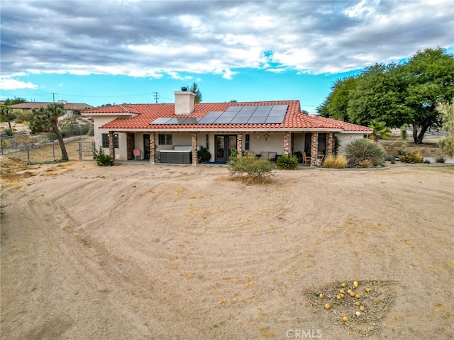 view of front of home with solar panels