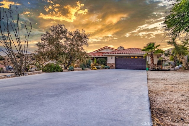 view of front of property with a garage