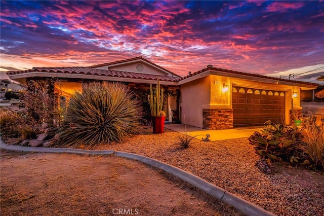 view of front of property with a garage