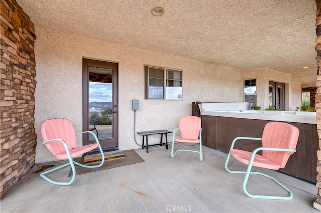 view of patio / terrace featuring a hot tub