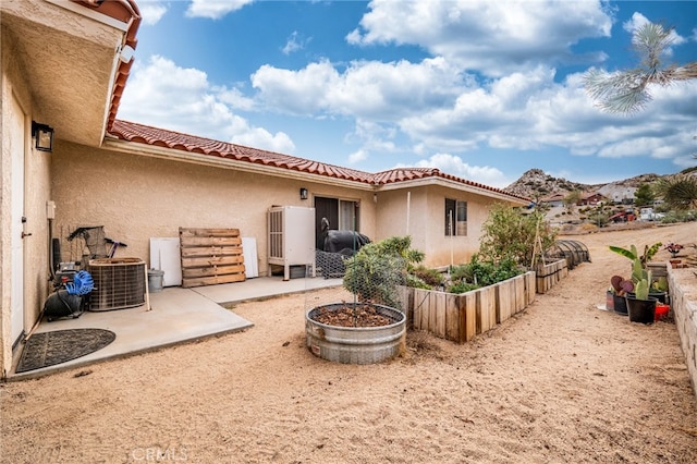 back of house featuring a patio and central AC