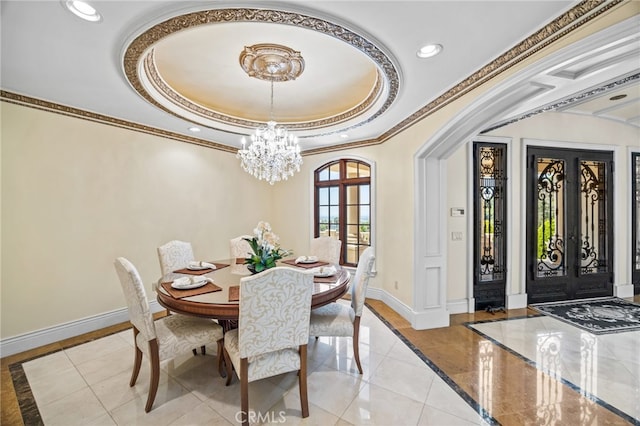 dining room with french doors, crown molding, light tile patterned floors, a chandelier, and a raised ceiling