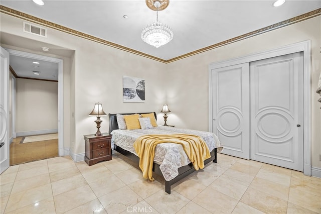 bedroom featuring an inviting chandelier and crown molding