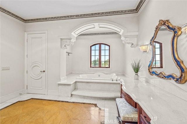 bathroom featuring ornamental molding, a tub to relax in, and tile patterned floors