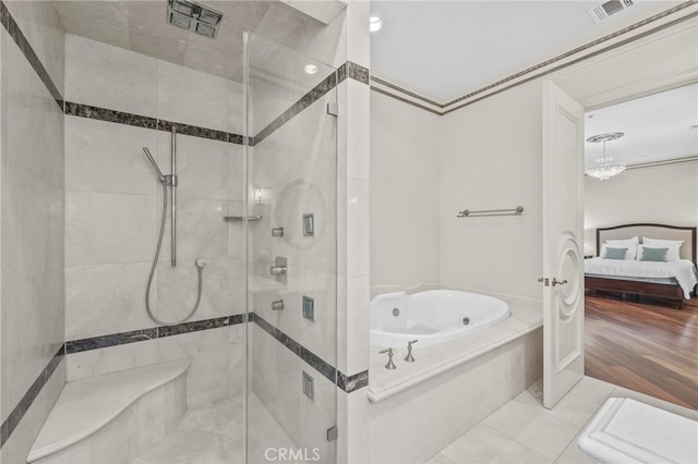 bathroom with independent shower and bath and wood-type flooring