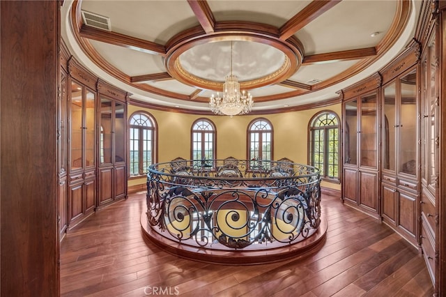 corridor featuring ornamental molding, french doors, a notable chandelier, and dark hardwood / wood-style flooring