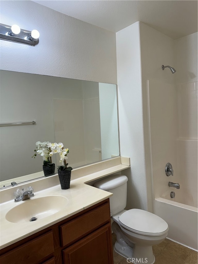 full bathroom with vanity, tub / shower combination, toilet, and tile patterned floors