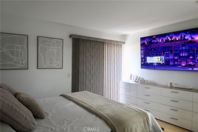 bedroom with light wood-type flooring