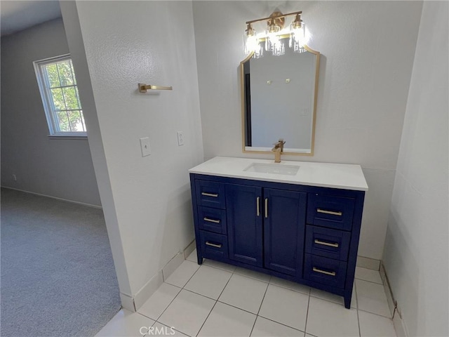 bathroom featuring tile patterned flooring and vanity