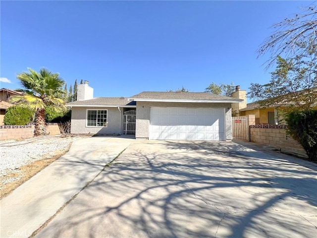 ranch-style home featuring a garage