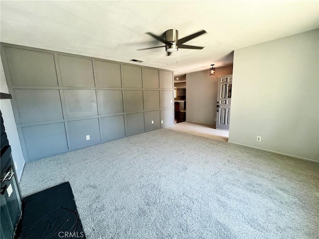 unfurnished bedroom featuring ceiling fan and light colored carpet