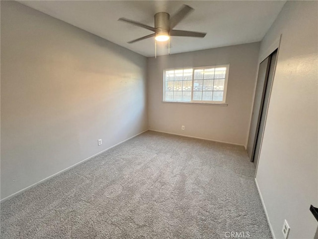 unfurnished bedroom with carpet and ceiling fan