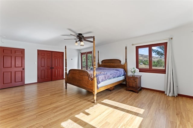 bedroom with ceiling fan and light hardwood / wood-style floors