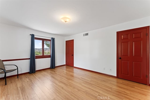 empty room with light wood-type flooring