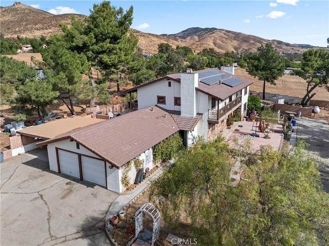 drone / aerial view featuring a mountain view