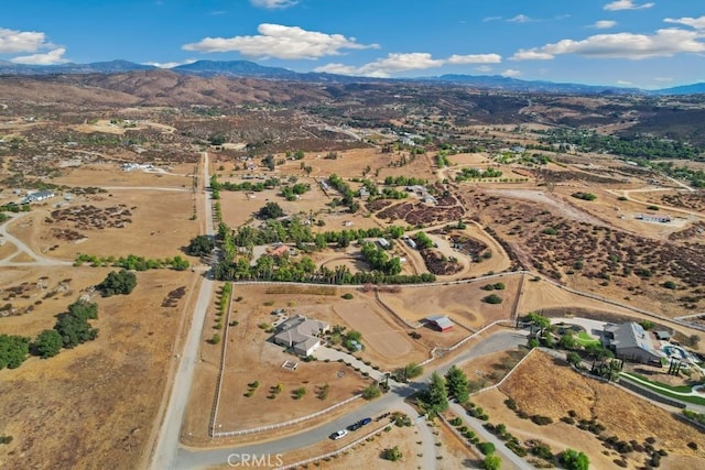 birds eye view of property featuring a mountain view