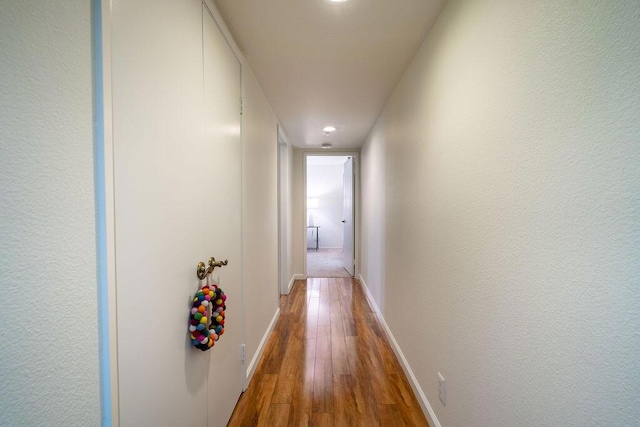 hallway featuring hardwood / wood-style flooring