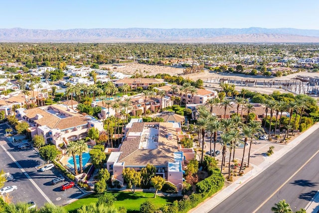 birds eye view of property with a mountain view