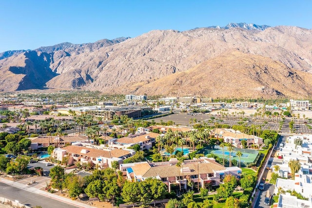 birds eye view of property with a mountain view