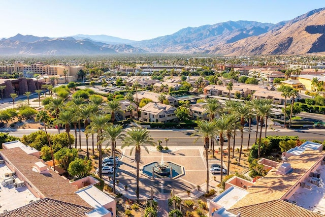 birds eye view of property with a mountain view