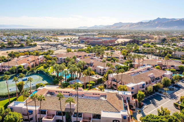 birds eye view of property with a mountain view