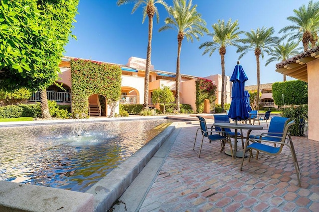 view of swimming pool featuring a patio area