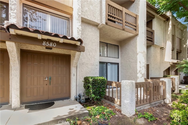 doorway to property with a balcony