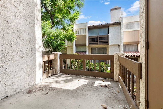 view of patio with a balcony