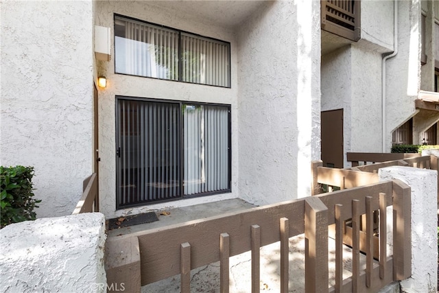 entrance to property with a balcony