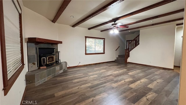 unfurnished living room featuring dark hardwood / wood-style floors, beamed ceiling, and ceiling fan