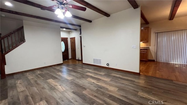 24861 Finhaut Dr, Crestline, CA 92325 - unfurnished living room with beam ceiling, a ceiling fan, dark wood-style flooring, and stairs