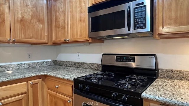 24861 Finhaut Dr, Crestline, CA 92325 - kitchen with appliances with stainless steel finishes and light stone countertops