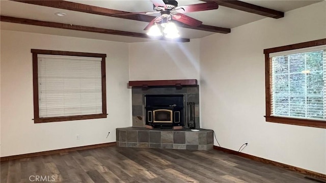 24861 Finhaut Dr, Crestline, CA 92325 - unfurnished living room with a wood stove, ceiling fan, wood finished floors, beamed ceiling, and recessed lighting