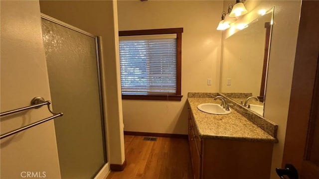 24861 Finhaut Dr, Crestline, CA 92325 - full bath with a shower stall, vanity, and wood finished floors