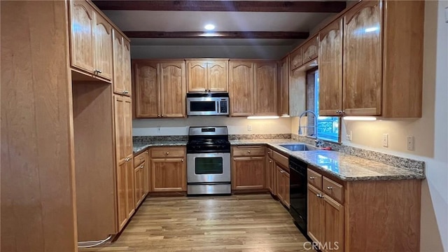 24861 Finhaut Dr, Crestline, CA 92325 - kitchen with stainless steel appliances, beamed ceiling, light wood-style floors, and dark stone countertops