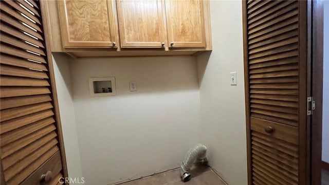 laundry area with washer hookup and cabinets