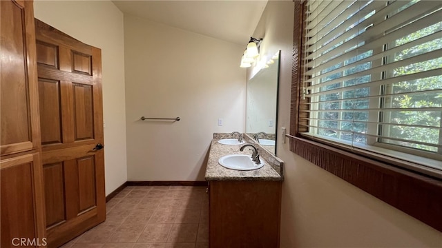 bathroom with vanity and tile patterned flooring