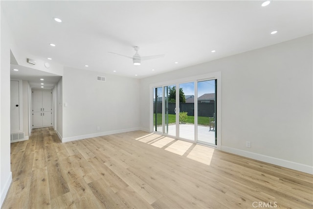 empty room with light hardwood / wood-style floors and ceiling fan