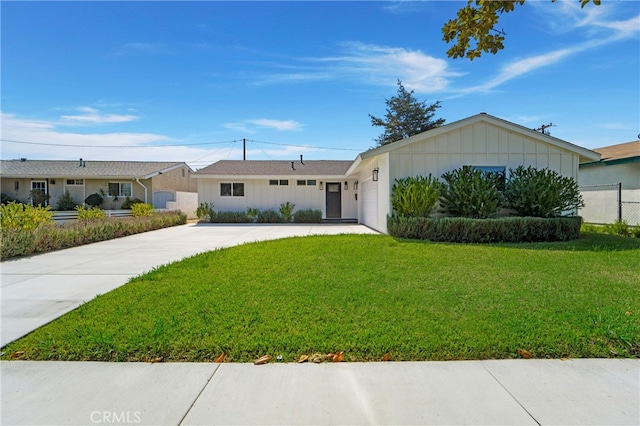 ranch-style home with a front yard and a garage