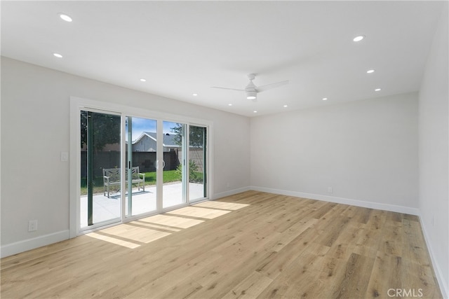 unfurnished room featuring light hardwood / wood-style floors and ceiling fan