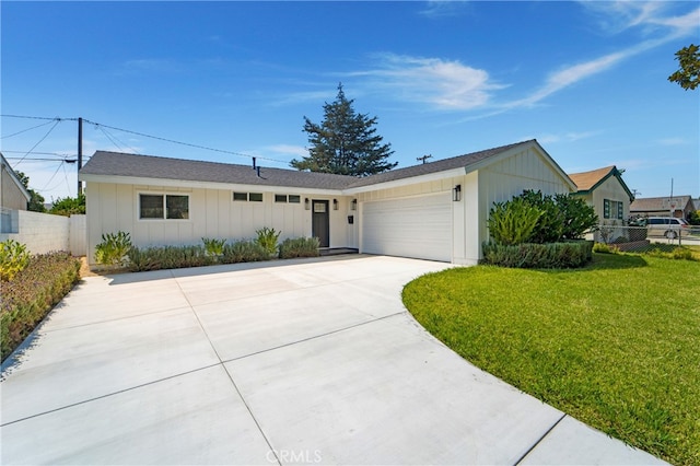 ranch-style home featuring a front yard and a garage