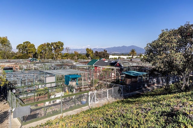 view of yard with fence and a mountain view