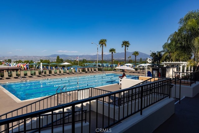 community pool with a mountain view