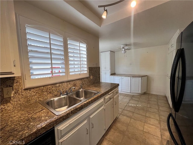 kitchen with ceiling fan, a sink, white cabinetry, black appliances, and tasteful backsplash